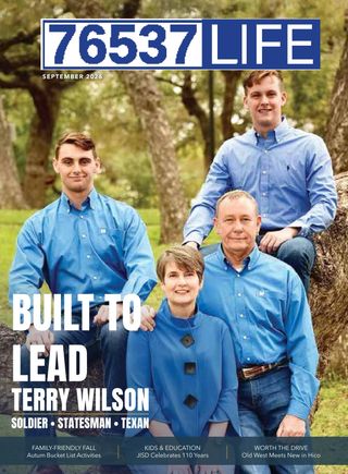 September 2026 cover of 76537 Life: Terry Wilson and his family in blue shirts, outdoors under the trees.