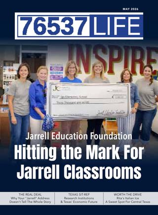 May 2026 cover of 76537 Life: Jarrell educators holding an oversized check in a school library.